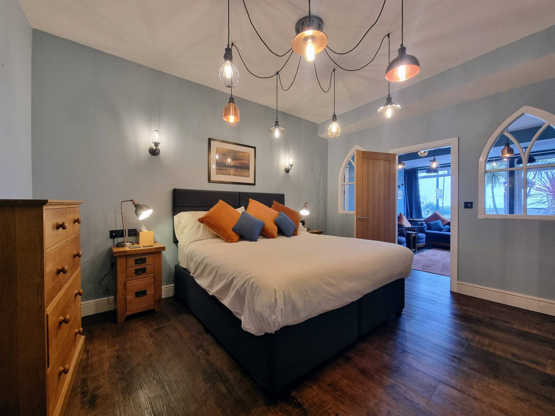 Bedroom in Suite 101 with views into the lounge and garden towards the Little Orme.
