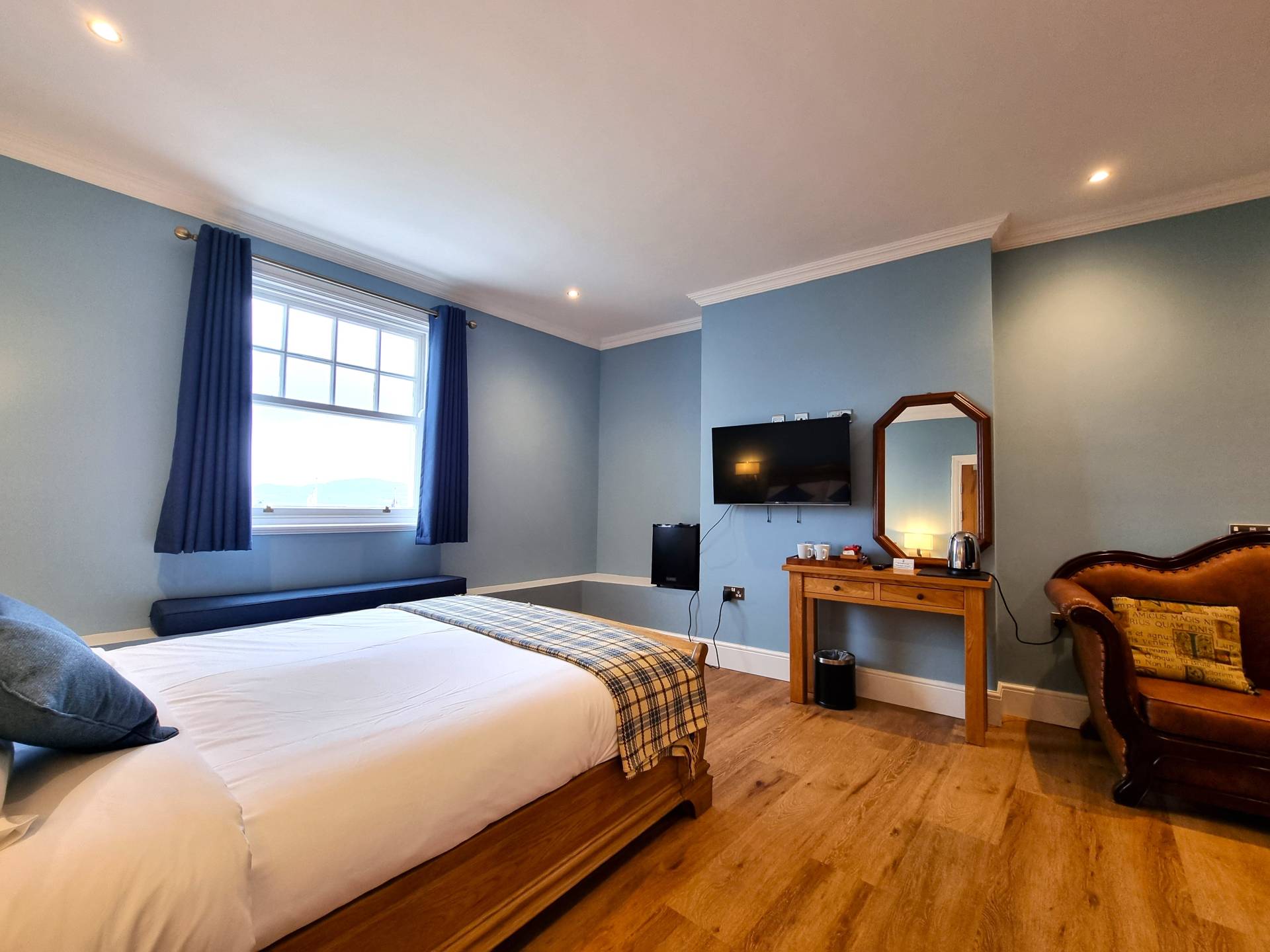 Room 202 at Min y Don Llandudno – sea-facing luxury room with fridge, tea and coffee-making facilities, and TV with Netflix.