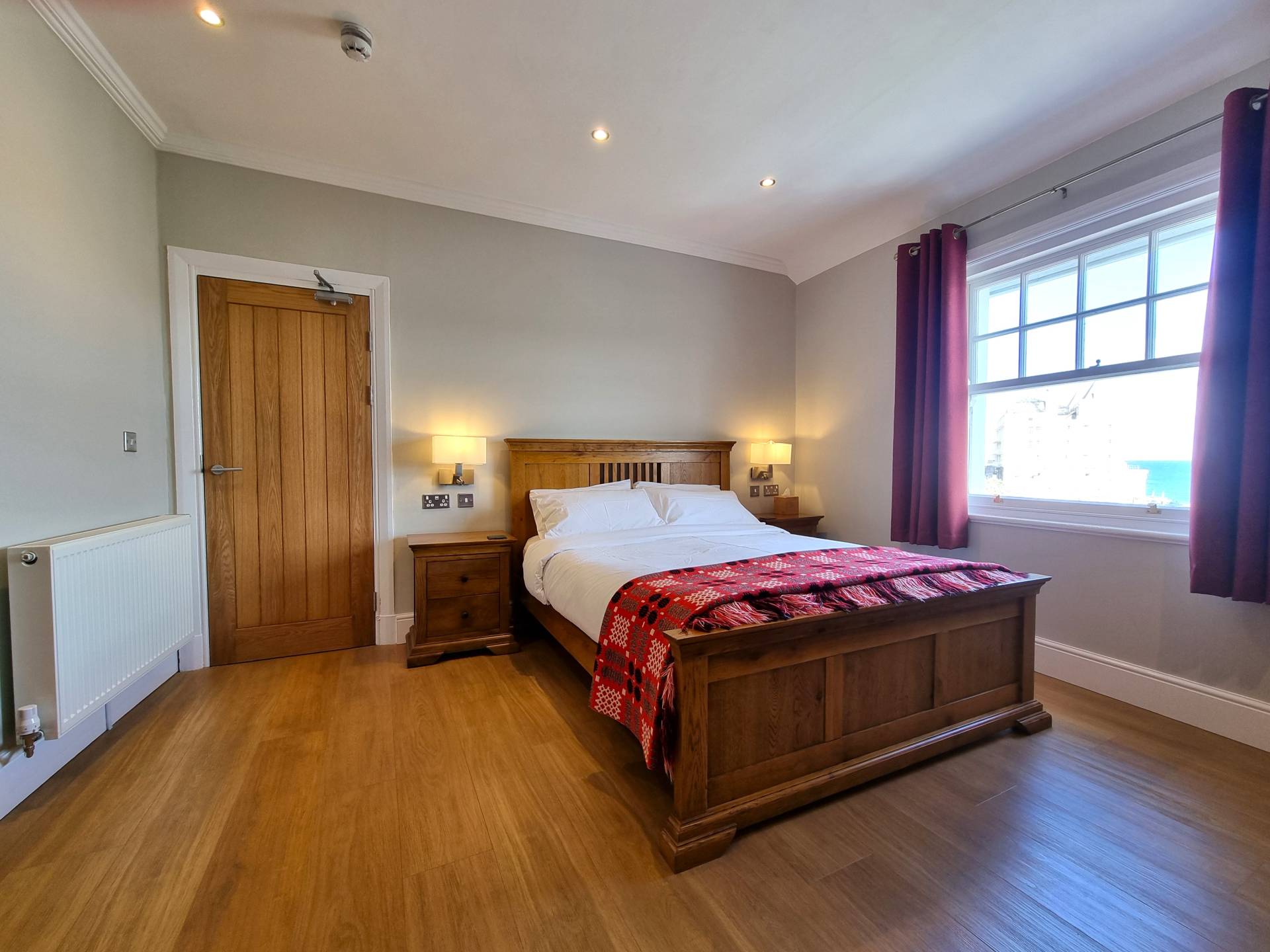 Room 302 at Min y Don Llandudno – third floor luxury king-sized double with panoramic sea views over North Parade and Little Orme, featuring flat-screen TV, Netflix, tea and coffee facilities, refrigerator, and high-speed Wi-Fi